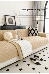 Detail of skin-friendly quilted beige sofa cover with diamond patterns and plush pillows