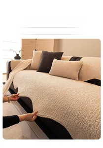 Macro detail of cream chenille sofa cover showing wavy edge and textured knit fabric