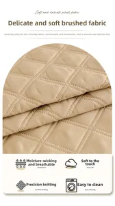 Macro shot of quilted beige fabric showing breathable texture and detailed stitching