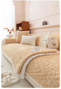 Detail of cream plush sofa cover with geometric embossed texture and lamb wool trim