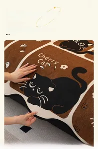 Detail of chenille sofa cover with thick jacquard cat pattern and durable reinforced edges