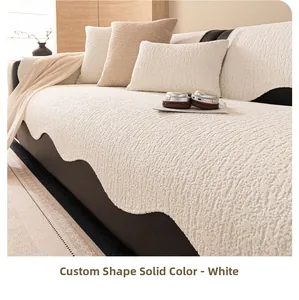 Close-up of thick white chenille sofa cover with irregular wavy edges and soft texture