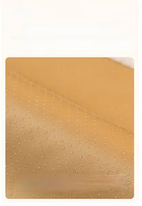 Detail of anti-slip silicone dots on the back of a plush velvet sofa cover fabric