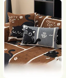 Detailed texture of chenille sofa cover and cat pattern pillows in brown and grey