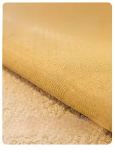 Detailed view of the anti-slip silicone particles on the plush teddy velvet sofa cover