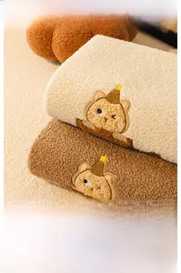 Close-up of cute cat embroidery on thick teddy fleece sofa cushion cover fabric