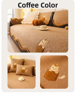 Detail of coffee brown teddy fleece sofa cover featuring cat embroidery and wavy edges