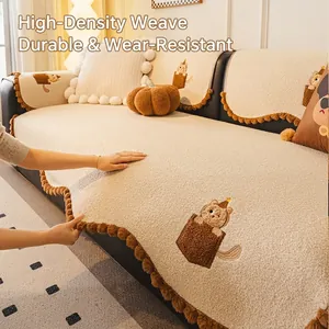 Thick beige teddy fleece sofa cover with cat embroidery and warm pom-pom edges