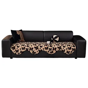 Thick plush sofa cover with butterfly pattern and wavy edges on black leather couch