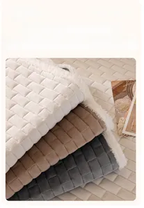 Close-up of quilted crystal velvet sofa cover with plush borders and thick texture
