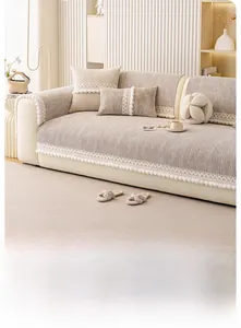Detail showing beige waffle weave sofa cover with elegant white lace and ball tassels