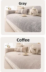 Detail of grey and coffee sofa covers with lace edges and white tassel ball ornaments