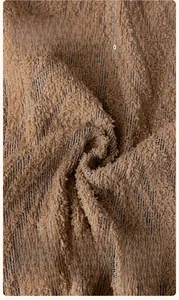 Close-up of thick brown striped rabbit plush fabric with soft high-density texture