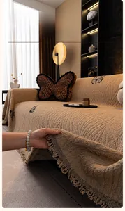 Detail of plush beige sofa cover showing non-shedding rabbit hair texture and fringe