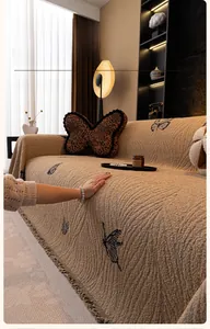Close-up of thick rabbit plush sofa cover with elegant butterfly patterns and fringe