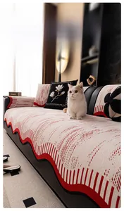Detail of cream chenille sofa cover with red wavy texture and soft woven fabric texture