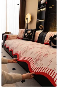 Detailed view of red and white striped chenille sofa cushion with black wavy edge finish