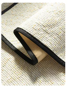 Detail showing high-weight chenille fabric with striped texture and durable black edging
