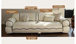 Detailed cream chenille sofa cover set with black wavy edges and decorative tassels