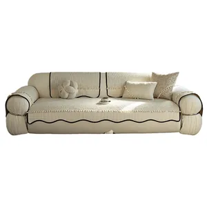 Beige chenille non-slip sofa cover set with elegant wave trim and tassel details
