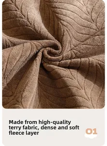 Macro detail of brown sofa cover fabric with embossed leaf pattern and soft towel yarn