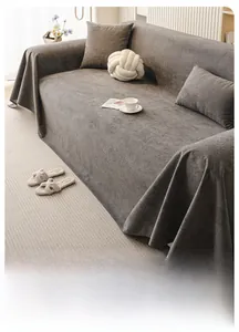 Detail of soft dark grey sofa cover showing cloud-like texture and matching cushions