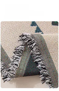 Close-up of Bohemian jacquard sofa throw with tassel edges and colorful geometry