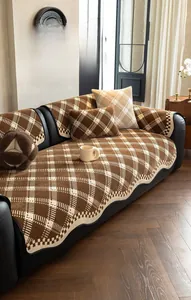 Detailed close-up of chenille checkerboard sofa cover with elegant scalloped edges