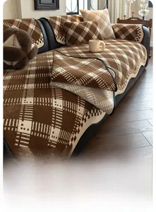 Macro detail of brown checkered chenille sofa cover with anti-slip texture and black edges