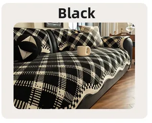 Detail of heavyweight black and white houndstooth chenille sofa cover with wavy edges