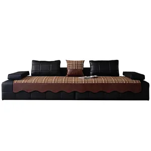 Brown and white checkered chenille sofa cushion cover with faux leather trim and pillows