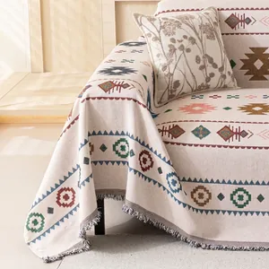 Bohemian style woven sofa blanket with geometric patterns and fringe for home decor