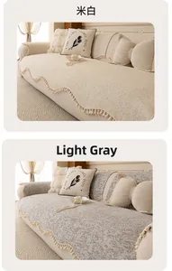 Detailed texture of chenille sofa cover with wavy fringe edges in white and gray colors