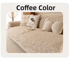 Close-up of coffee brown chenille sofa cover with white pom-pom fringe and texture