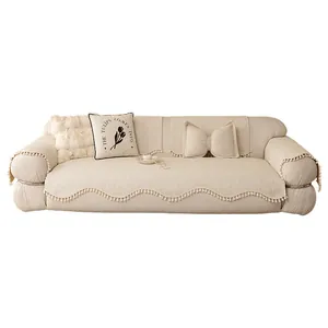 Beige chenille sofa cover set with fringe details and decorative tulip tulip pillows