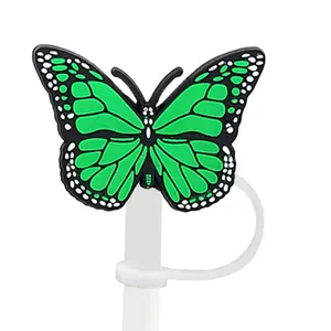 Détail macro du bouchon de paille papillon vert avec protection anti-poussière sur paille