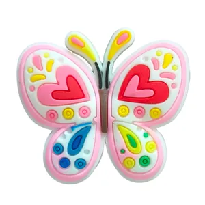 Macro shot of 3D PVC butterfly shoe charm with heart patterns for clog sandals