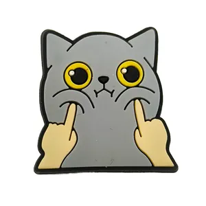 Detail of funny gray PVC cat shoe charm with humorous gesture for clog decoration