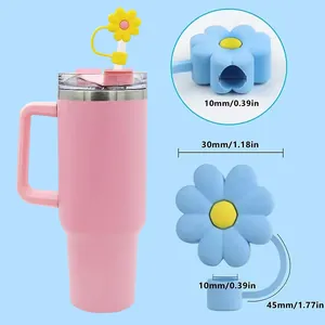 Macro detail of 10mm pink flower straw cover set on a stainless steel insulated tumbler