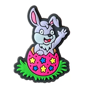 Detail of PVC cartoon rabbit hatching from Easter egg charm for garden clogs decoration