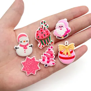 Pink Christmas theme PVC shoe charms set featuring Santa and Snowman in a hand display