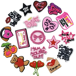 Set of 18 Y2K cartoon PVC shoe charms with pink hearts and trendy slogans on white background
