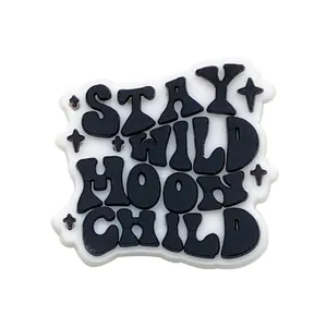Detail of Stay Wild Moon Child PVC shoe charm with 3D embossed stars for clogs