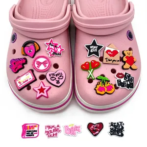 Y2K style PVC shoe charms set featuring pink cartoon icons on a clogs scene