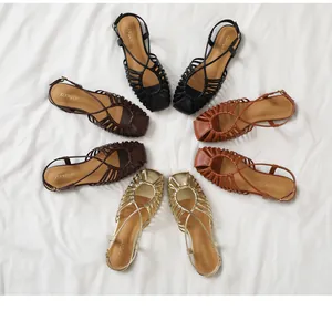 Flat woven beach sandals shown in black, brown, tan, and gold with adjustable buckles