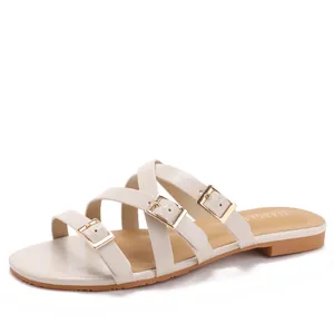 White faux crocodile flat slide sandals with triple straps and gold adjustable buckles