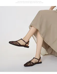 Close-up of brown woven T-strap Roman sandals featuring a chic square toe design