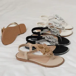 Flat gladiator sandals for women with sparkling rhinestone flowers and elastic back strap