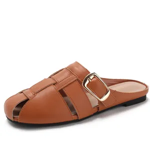 Women's brown woven leather mule slippers with gold buckle and flat heel for summer