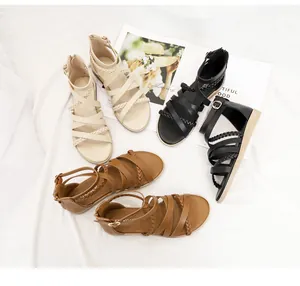 Detail view of woven bohemian gladiator sandals in beige, black and brown leather colors